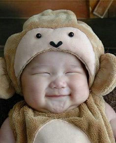 smiling pooping baby in a cute monkey costume | Tacky Harper's Cryptic Clues smiling pooping baby in a cute monkey costume | Tacky Harper's Cryptic Clues