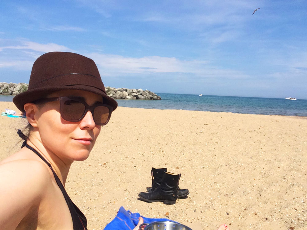 beach time mother jackers erica in sunglasses and German hat at the beach by Lake Michigan