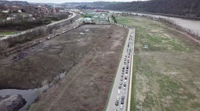 food lines still from a video of miles of cars in Duquesne, Pennsylvania, waiting for food from a food bank